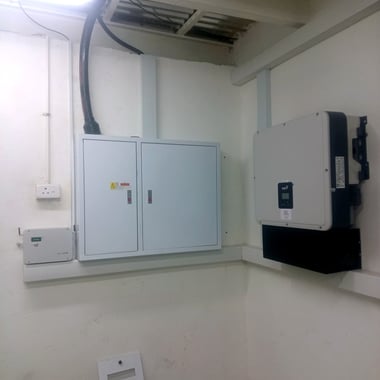 FoxESS inverter with Crown Technologies label, next to the distribution board