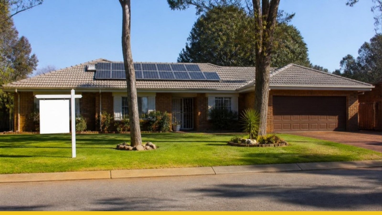 Johannesburg home with rooftop solar panels and a for-sale board on the lawn